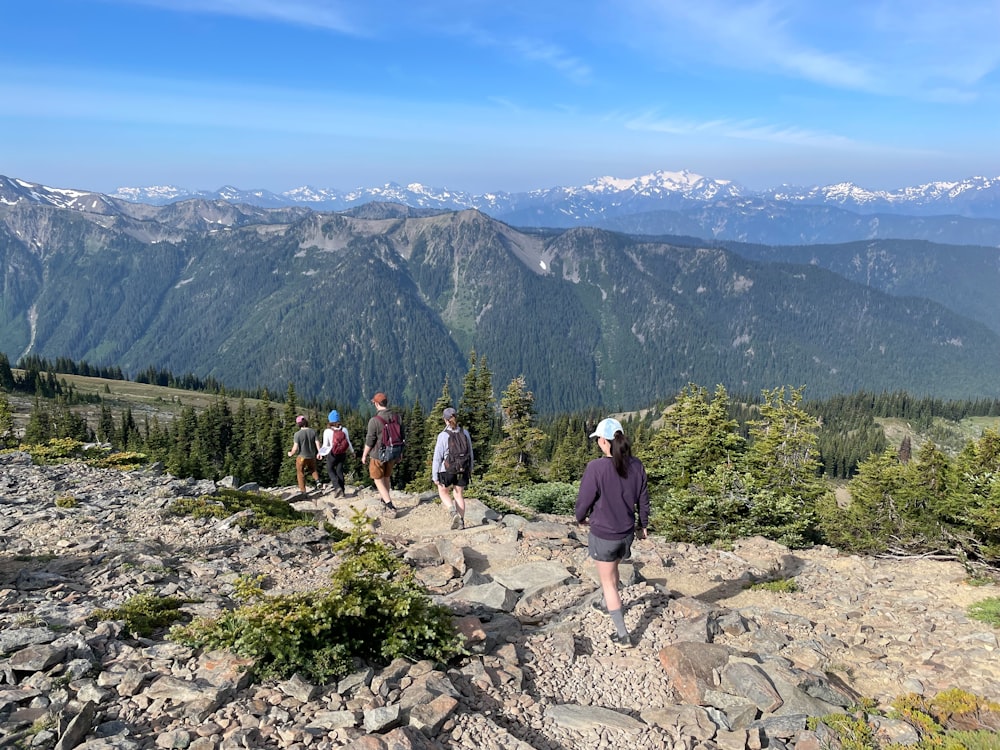 a group of people hiking up a mountain