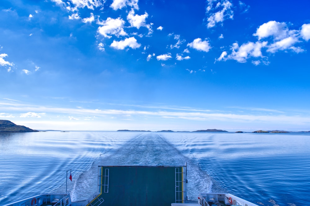 a boat traveling across a large body of water