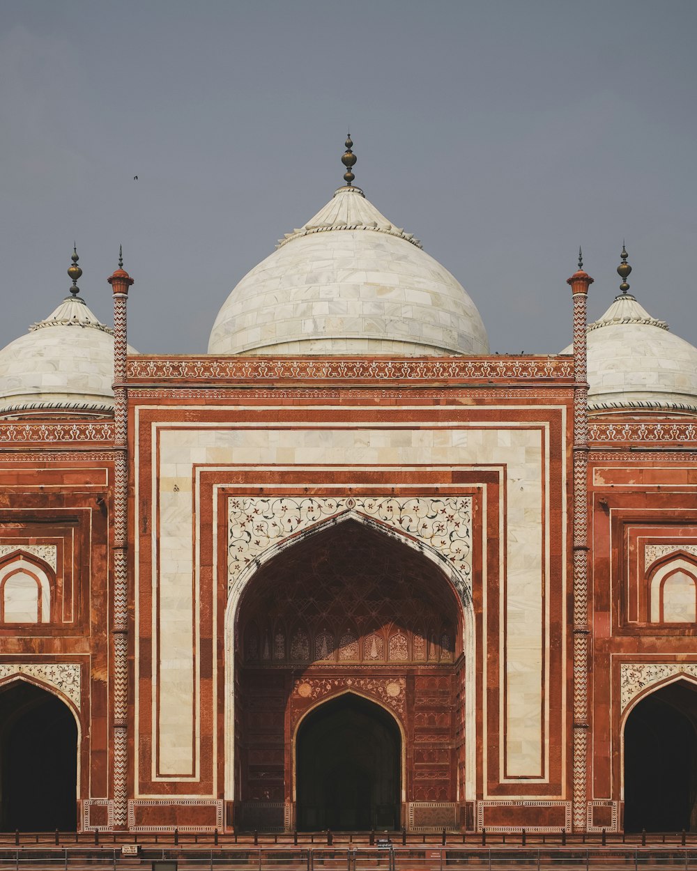 a red and white building with a white dome