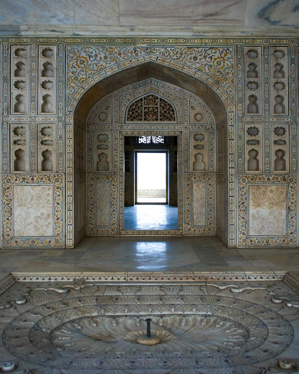 a doorway in a building with intricate carvings on the walls