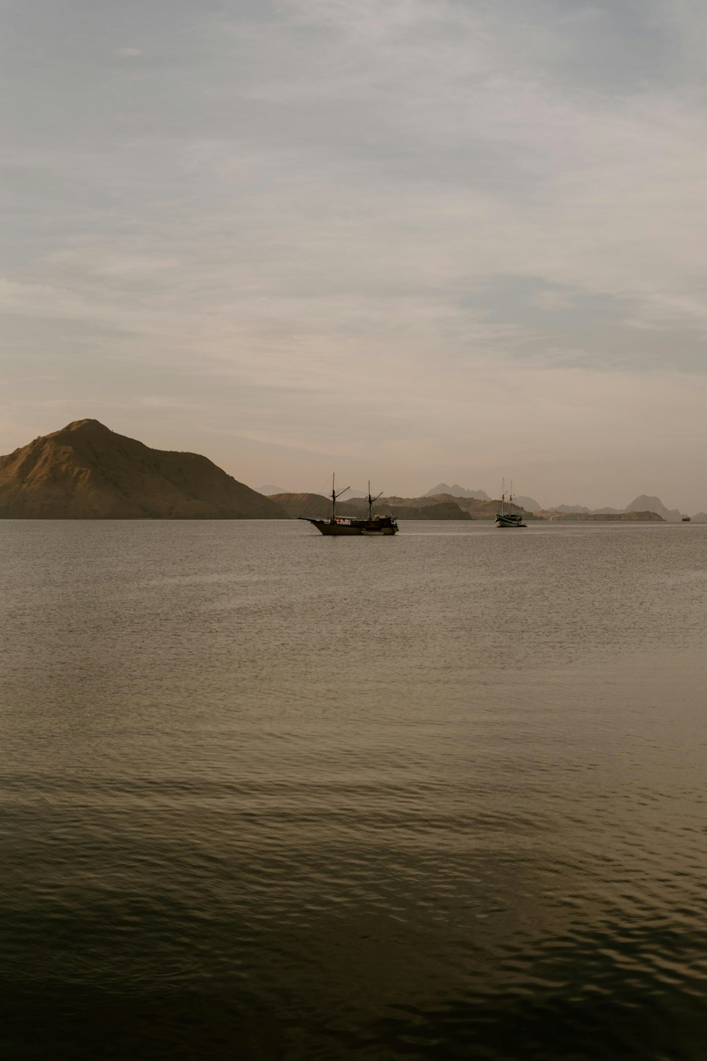 a boat floating on top of a large body of water