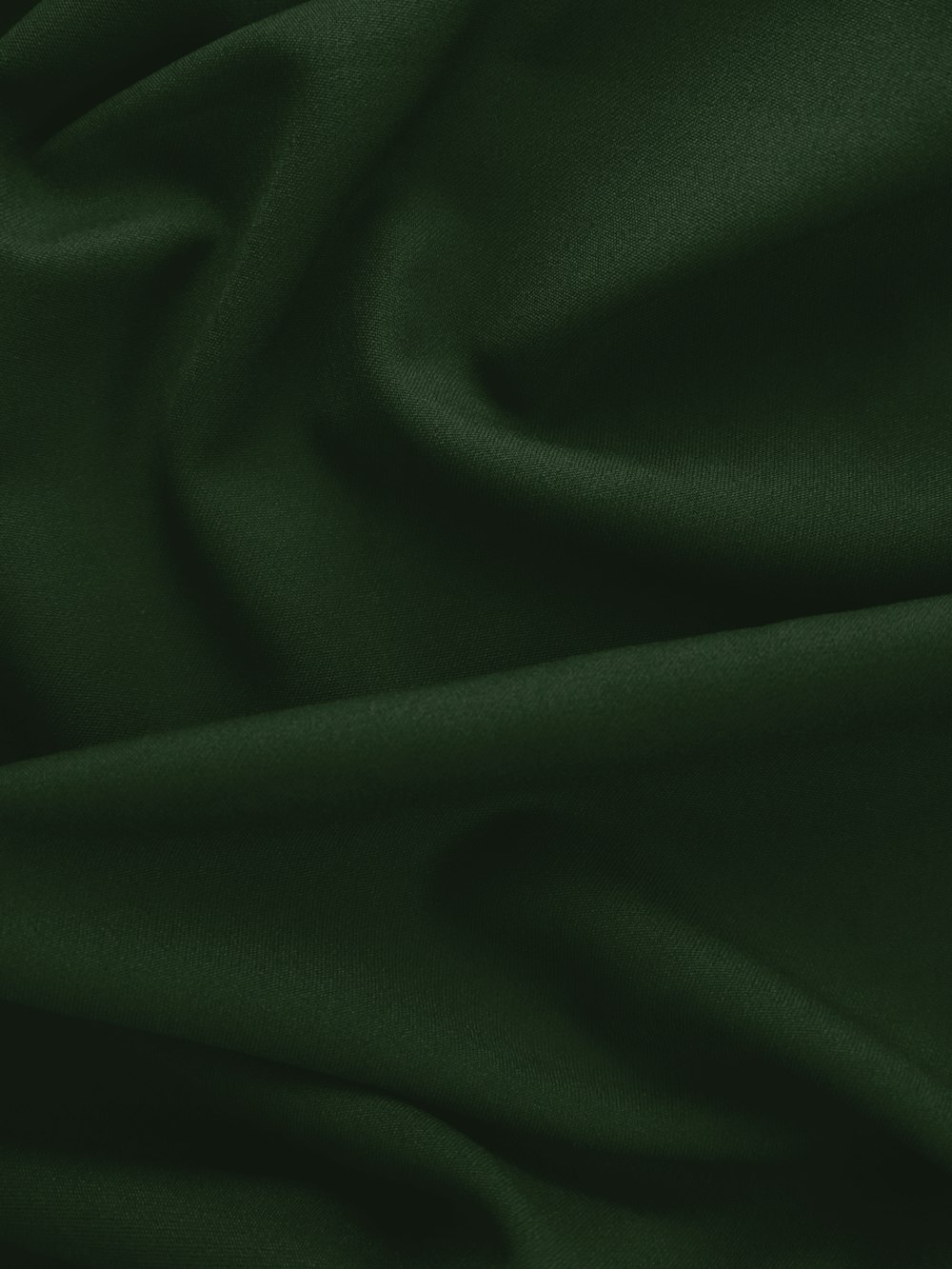 a close up of a dark green fabric