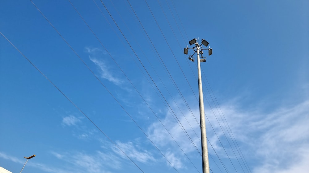 a street light on a pole under a blue sky