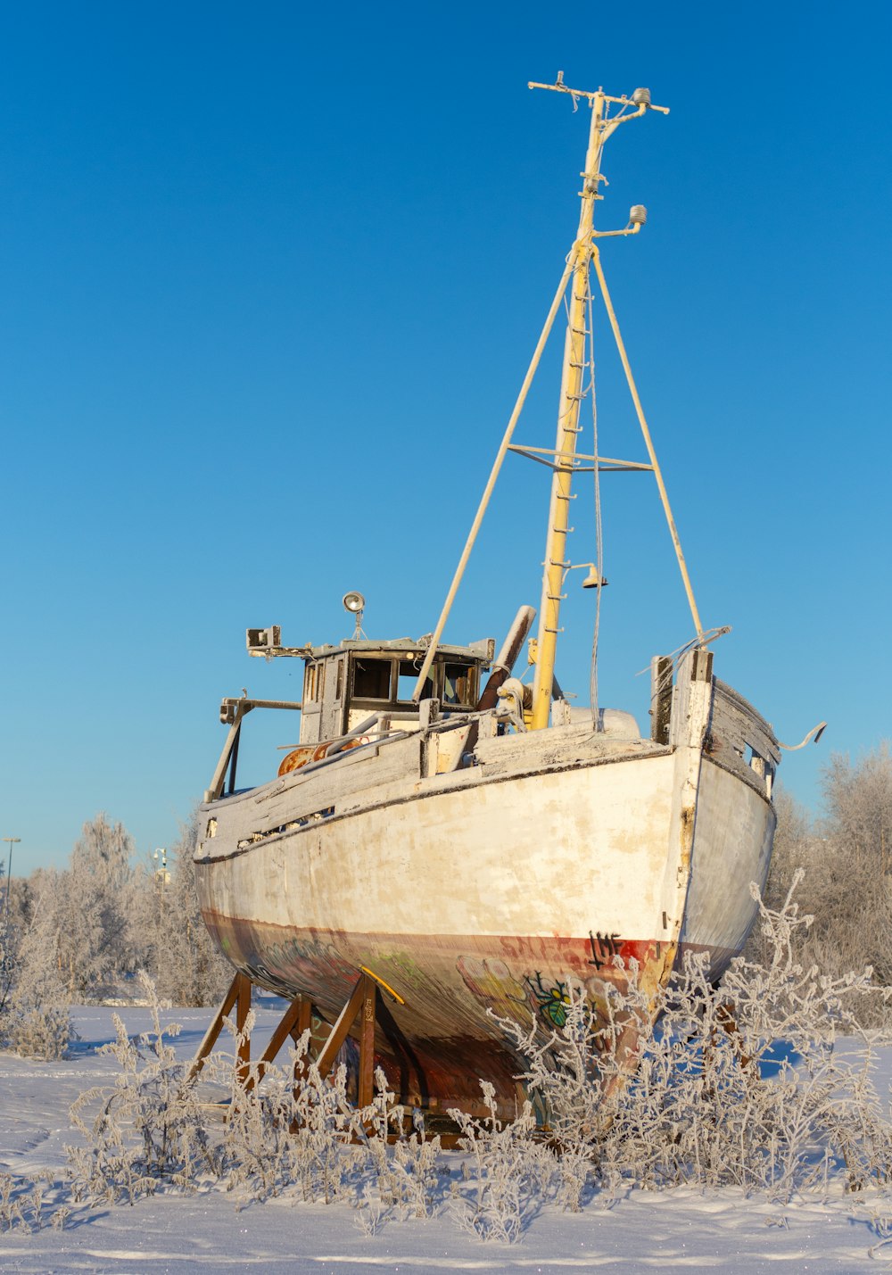 a boat that is sitting in the snow