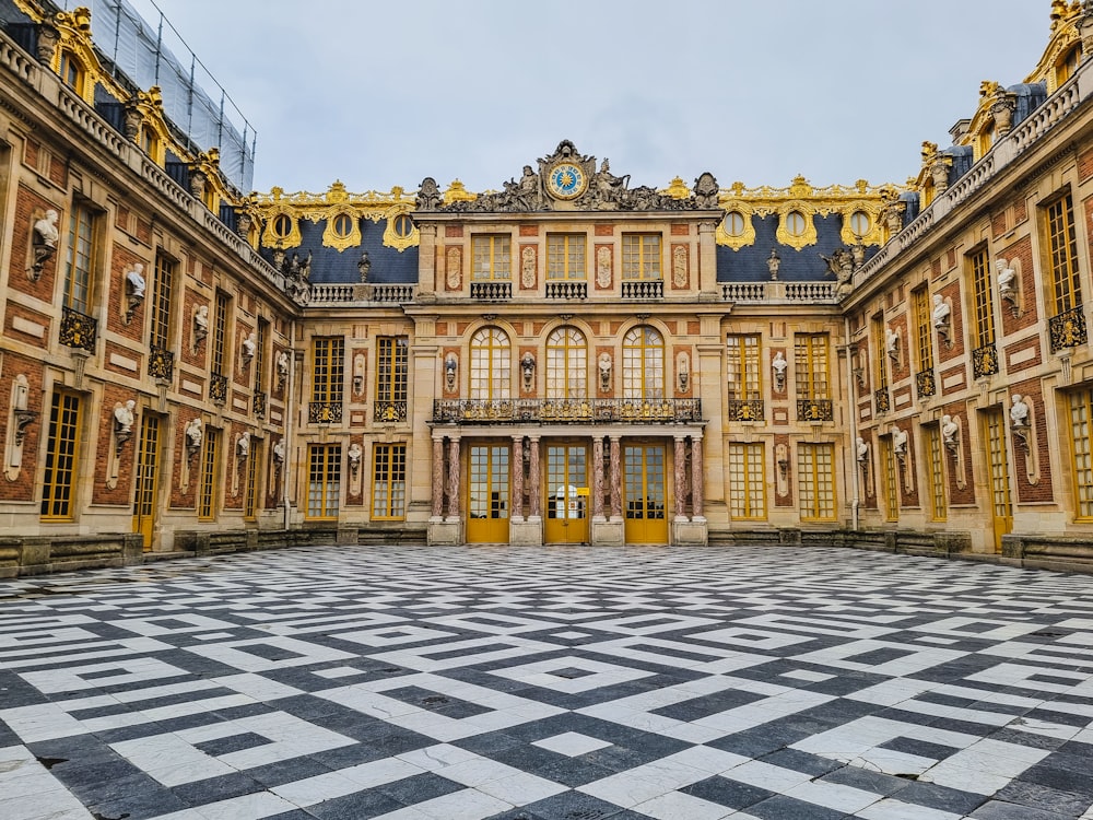 a large building with a checkered floor in front of it