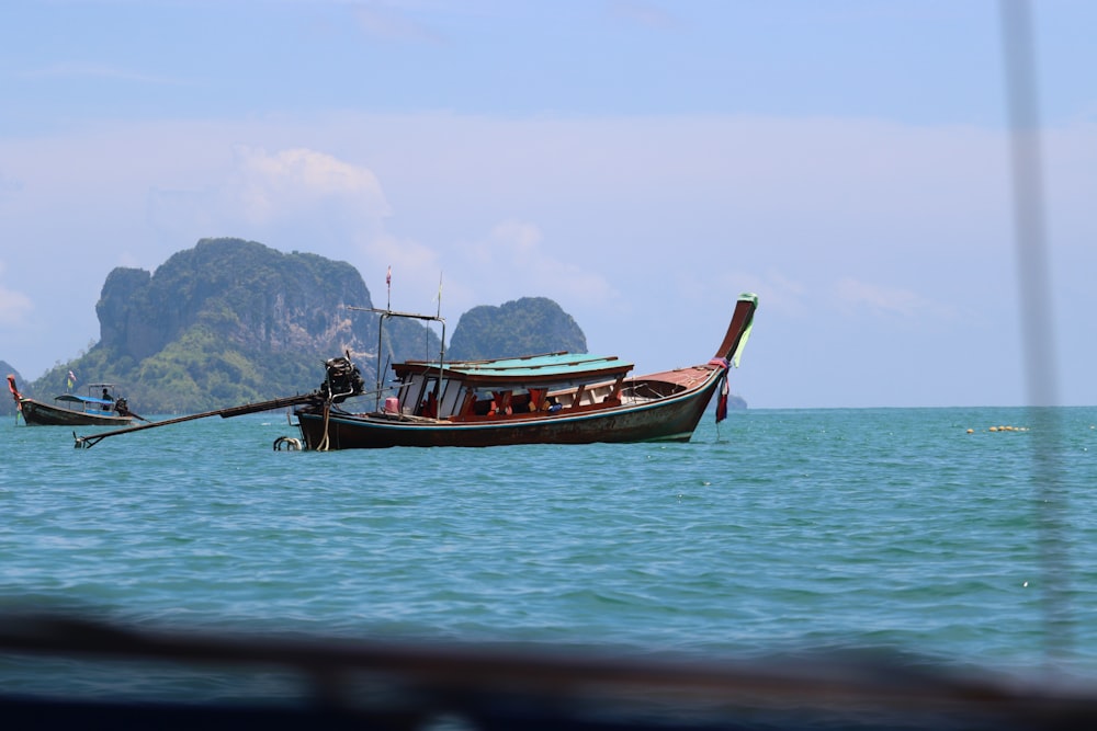 a boat floating on top of a large body of water