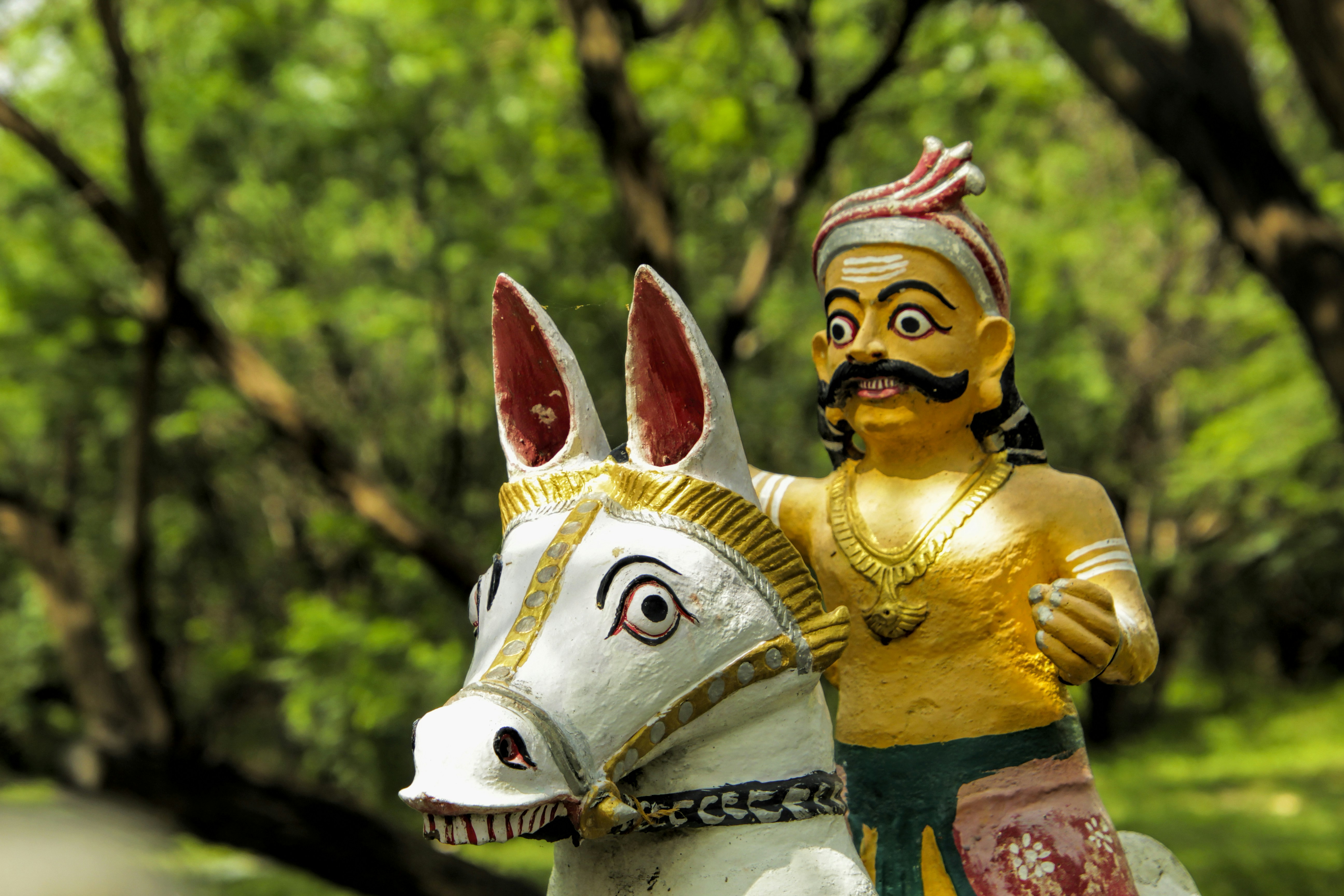 a statue of a man riding a white horse