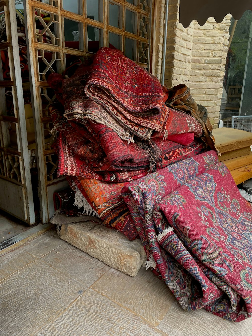 a pile of blankets sitting on top of a floor