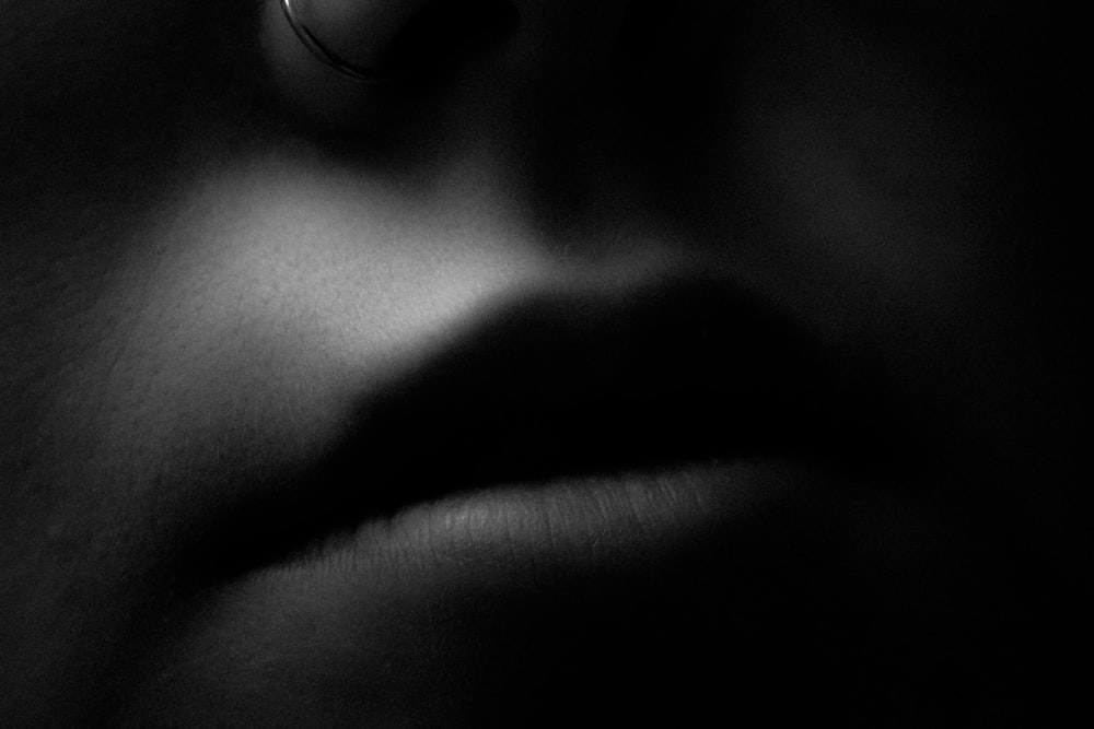 a close up of a person's face in the dark