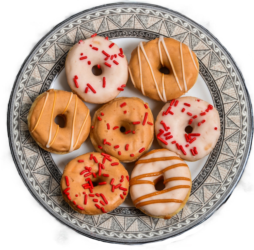 a plate full of different kinds of donuts