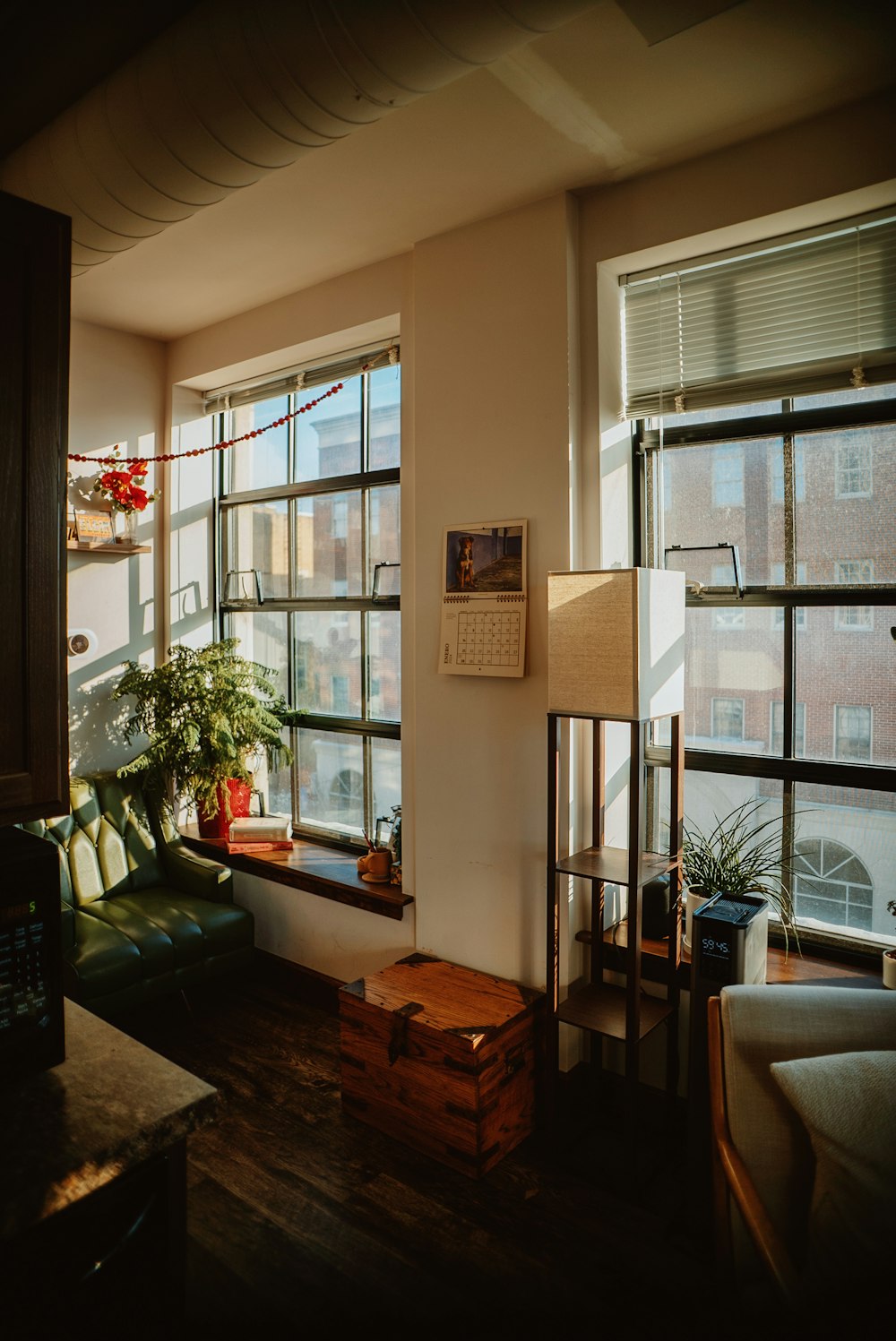 a living room filled with furniture and a large window