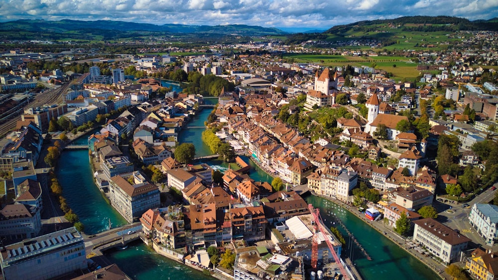 an aerial view of a river running through a city