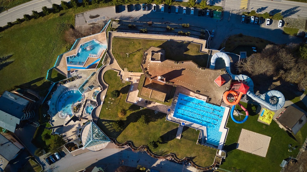 an aerial view of a water park with a water slide