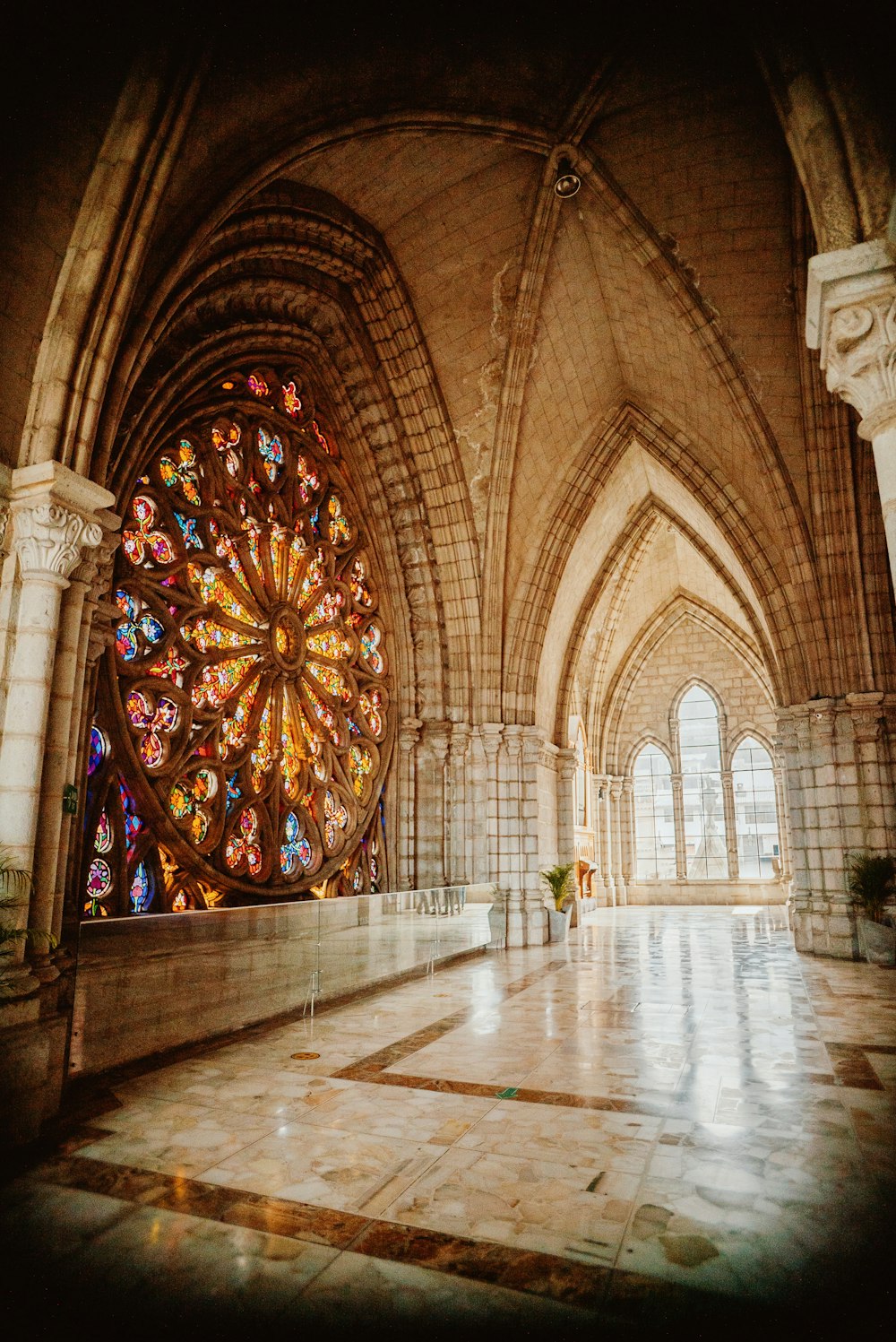 a large stained glass window inside of a building