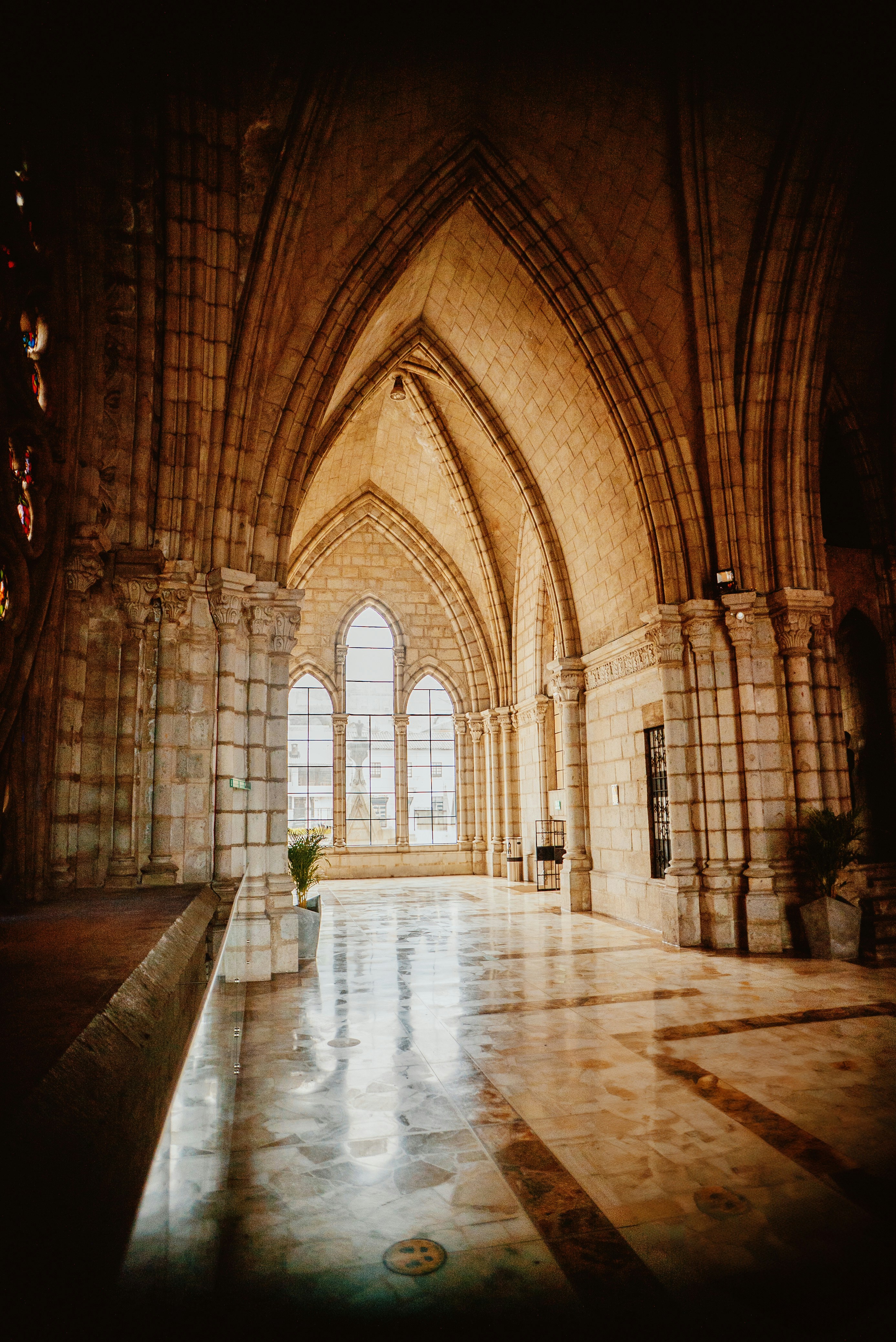 a room with a large window and a tiled floor