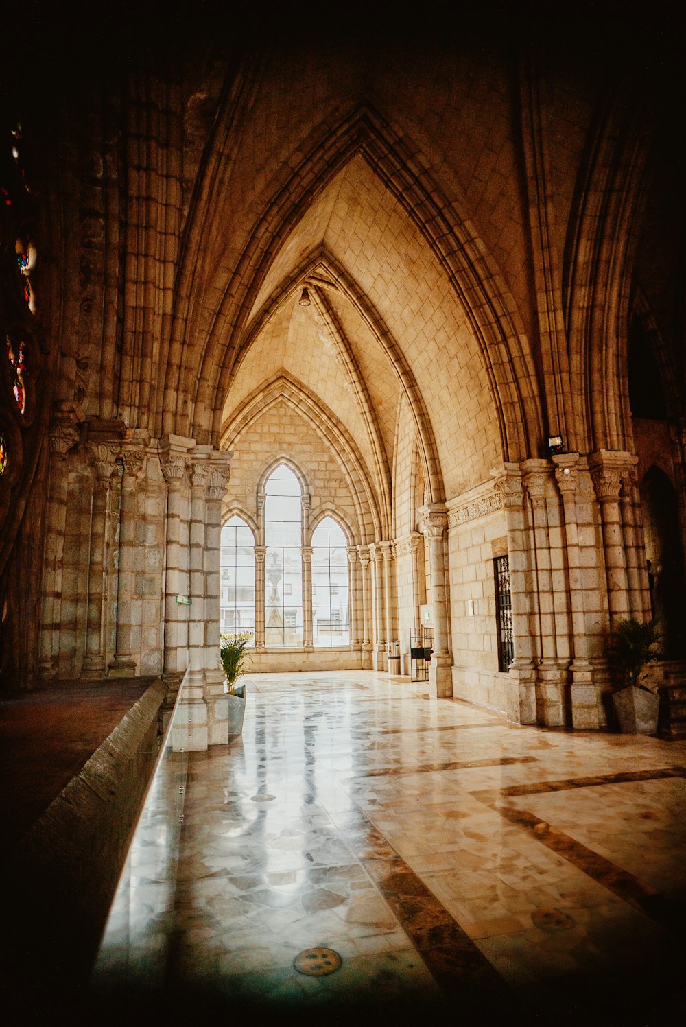 a room with a large window and a tiled floor