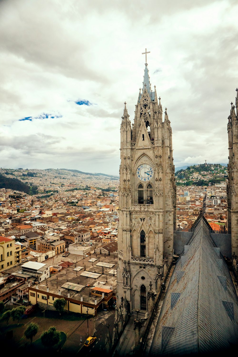 a large cathedral with a clock on it's side