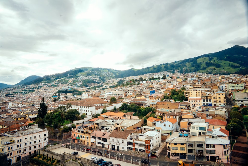 a view of a city with mountains in the background