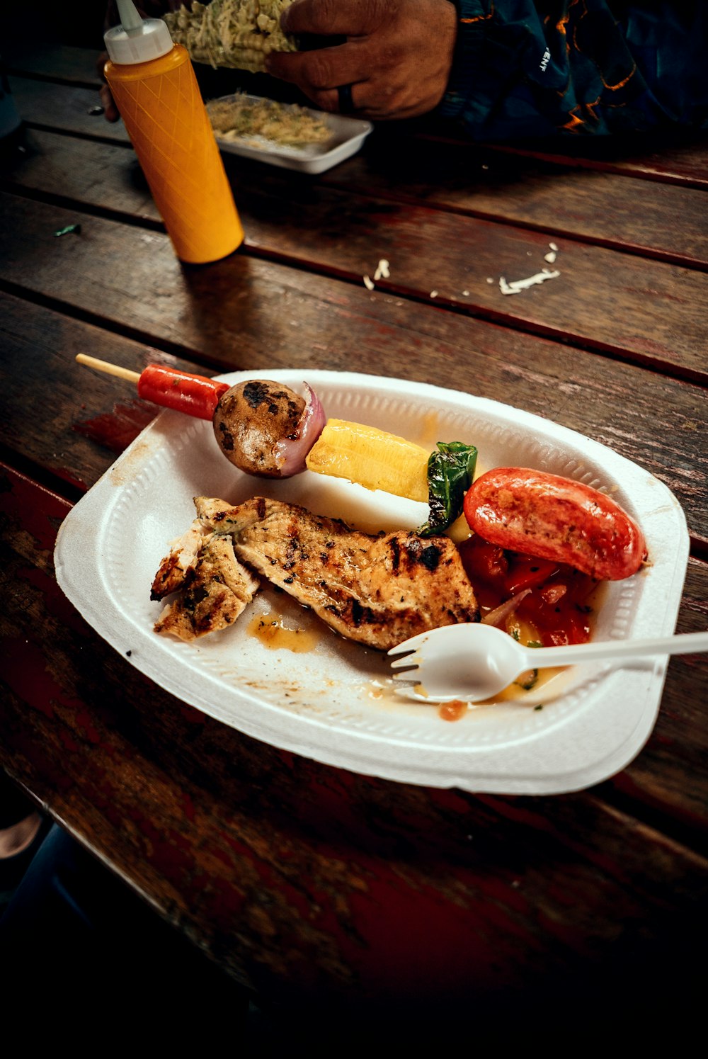 a white plate topped with meat and veggies