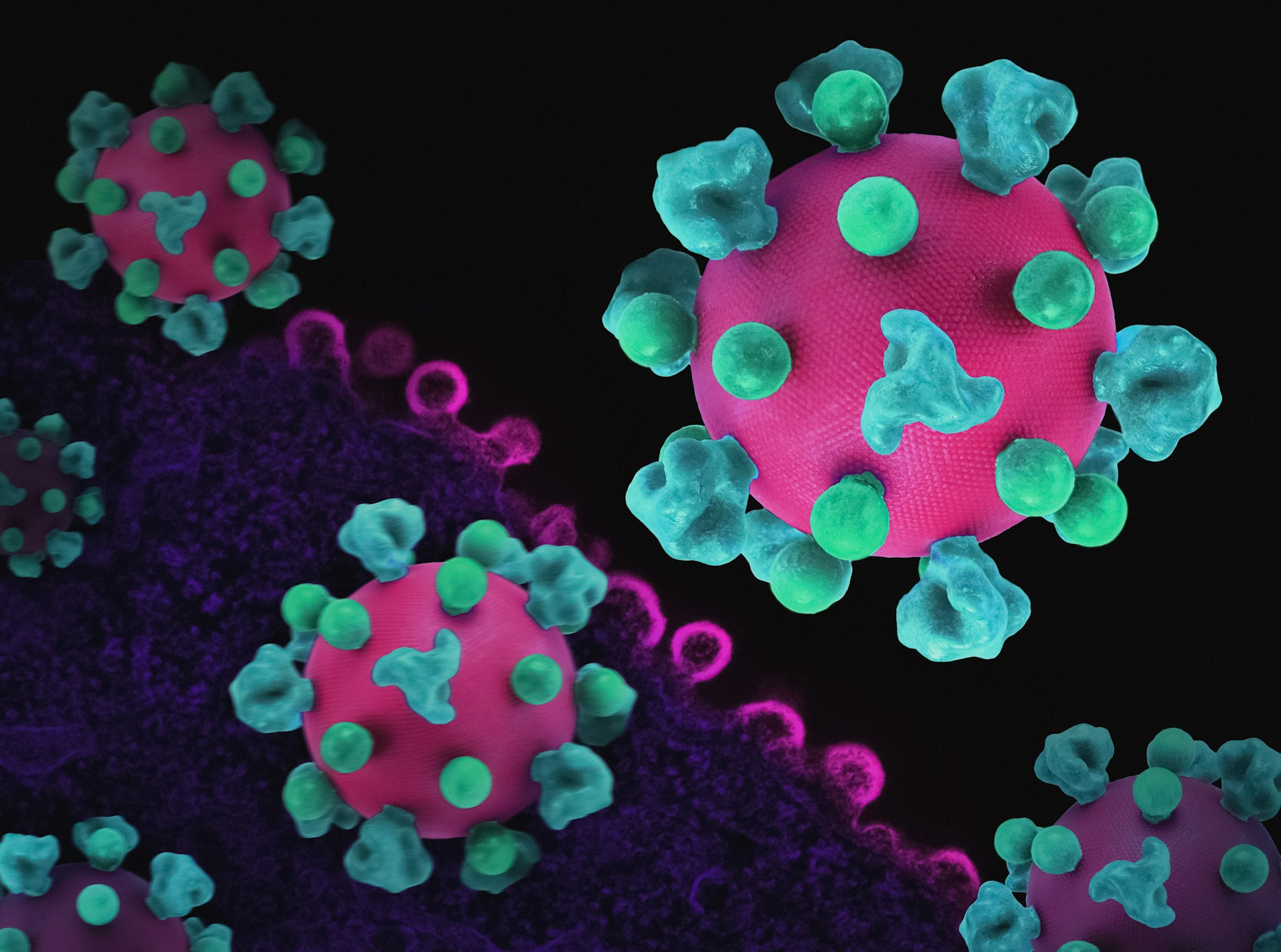 a close up of a cell phone with green and pink balls