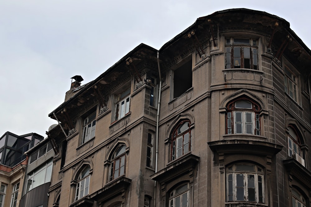 an old building with a clock on the front of it