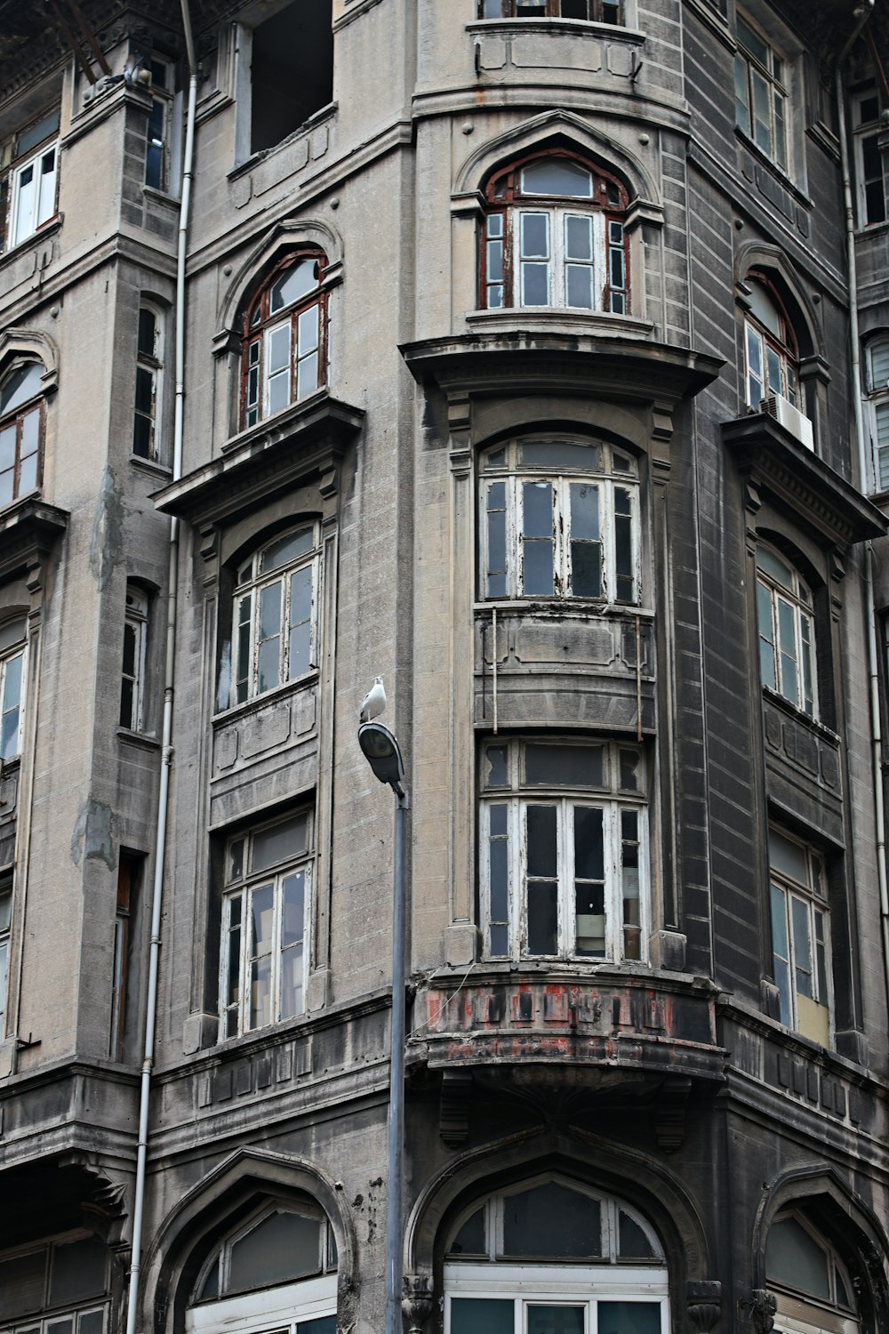 an old building with a clock on the front of it