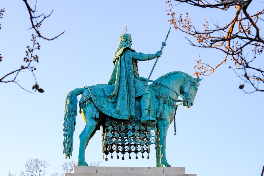 a statue of a man riding on a horse