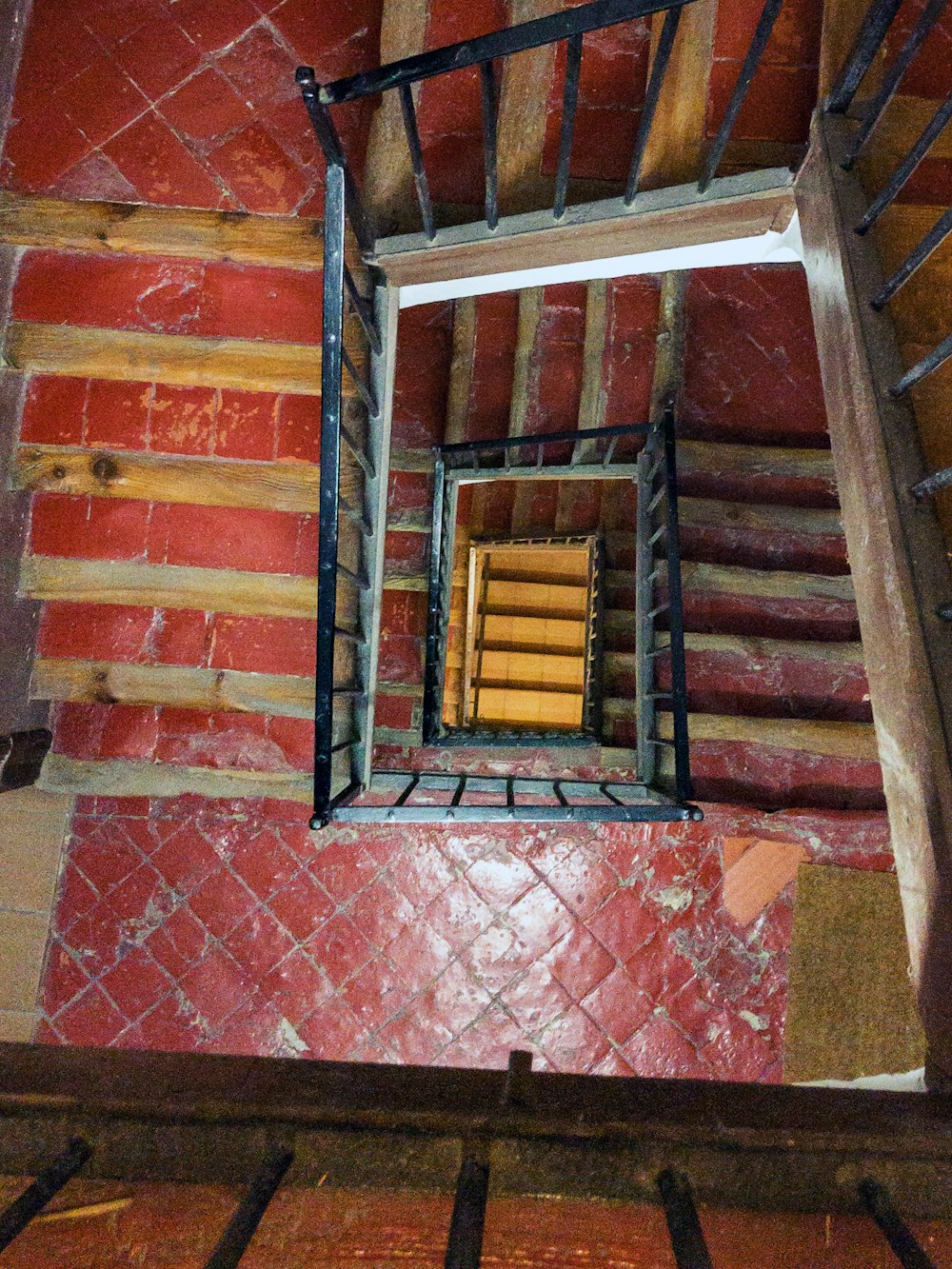 a stair case with a window in the middle of it