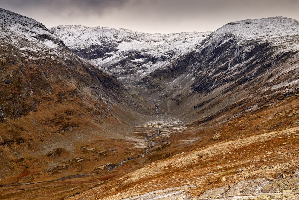 a view of a mountain range with snow on the mountains