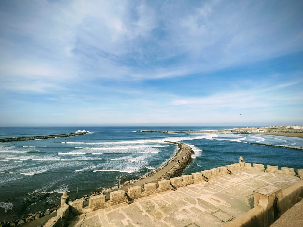 a large body of water with waves coming in