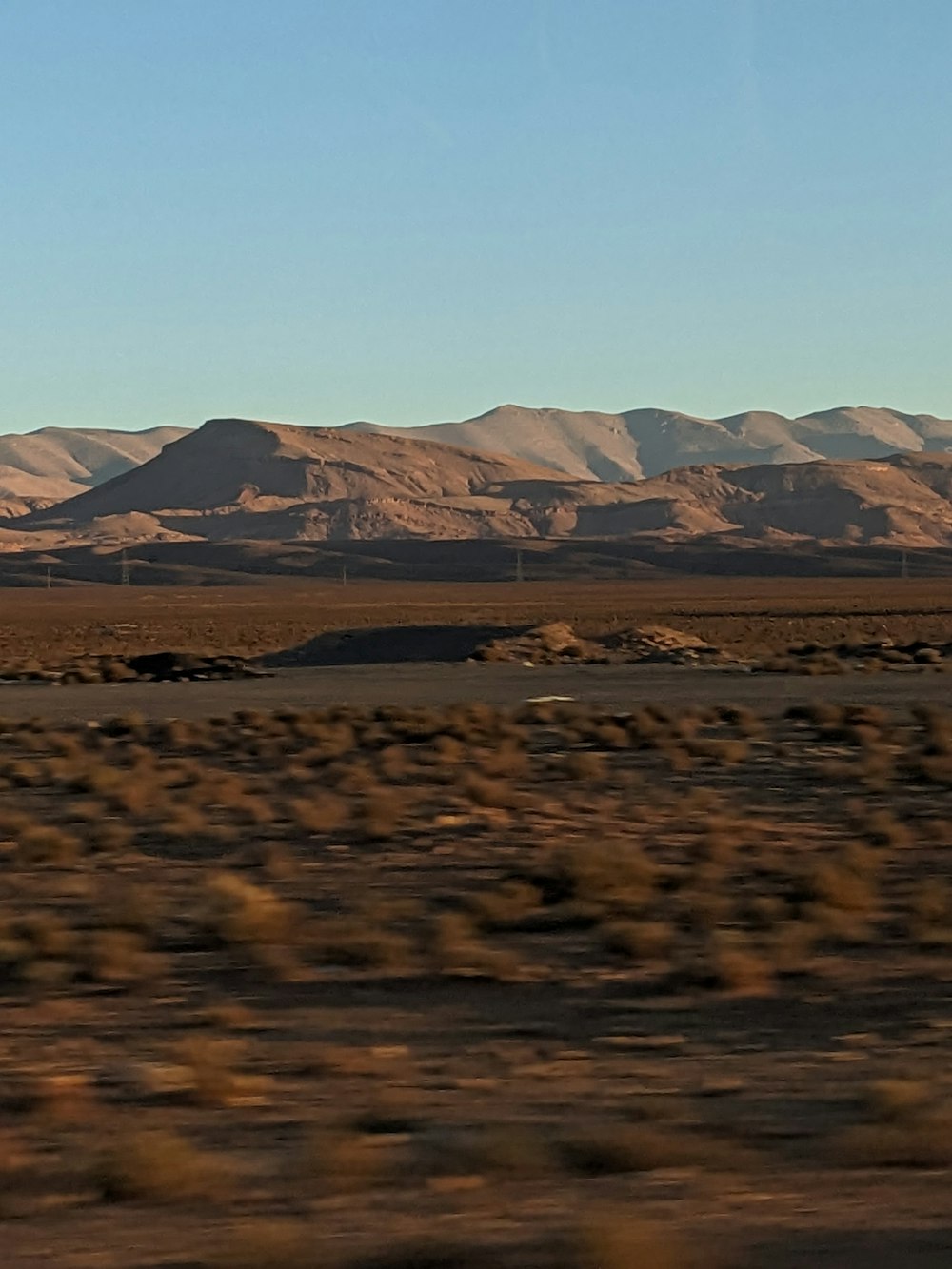 a person riding a horse in the middle of the desert