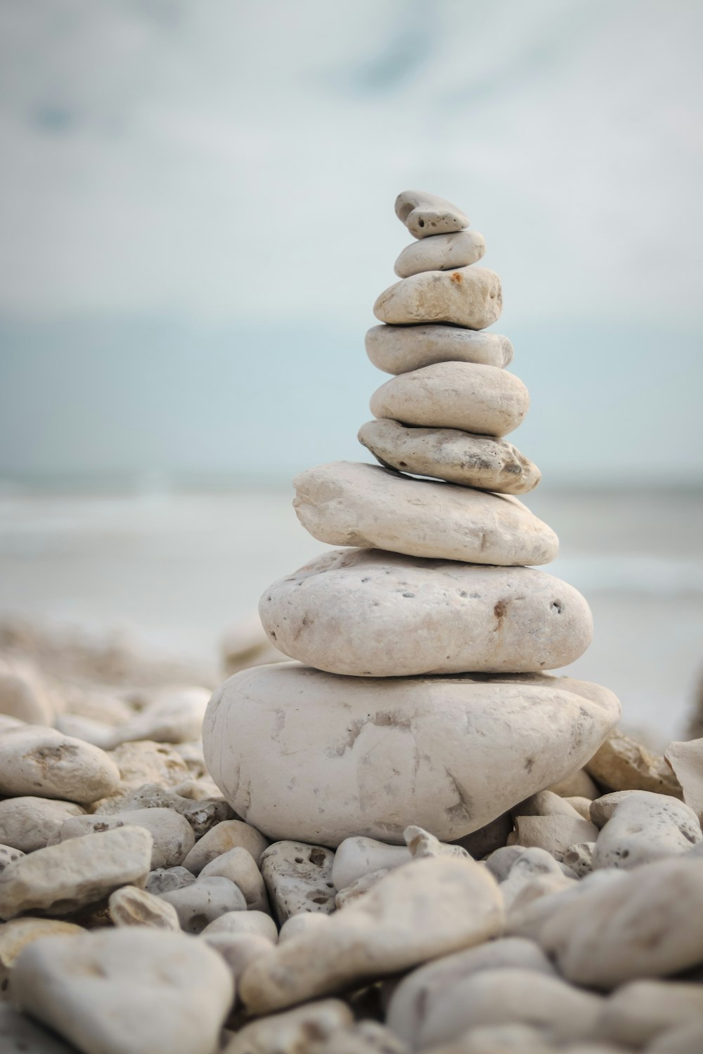 a stack of rocks sitting on top of a beach