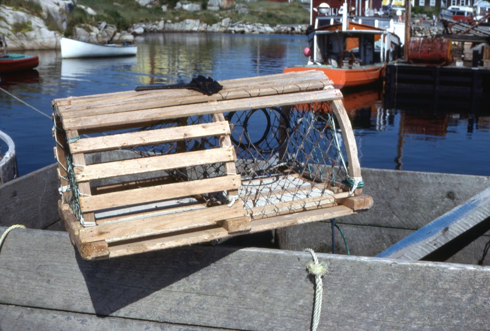 a wooden crate sitting on top of a wooden dock