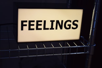 a sign that says feelings on it