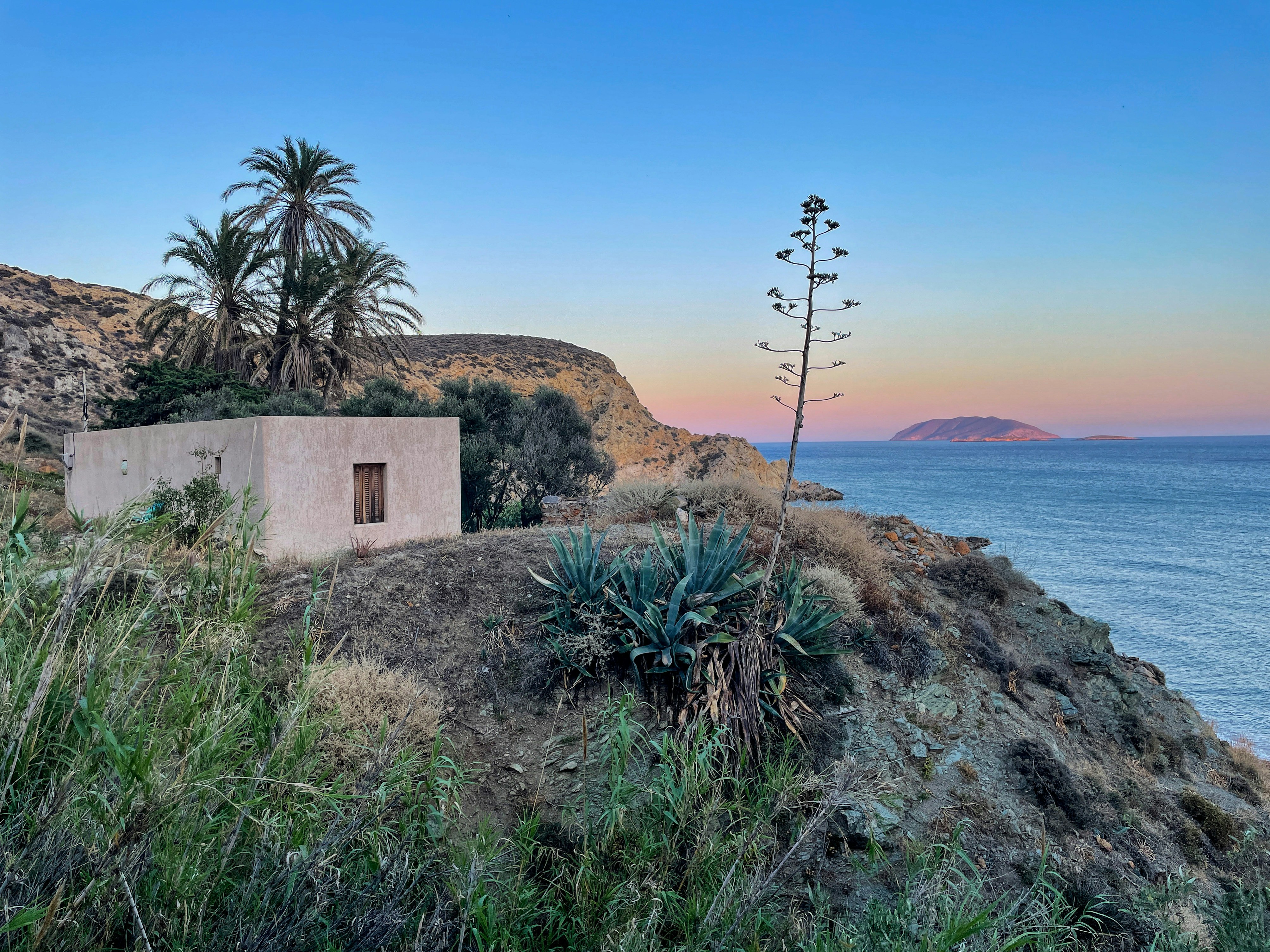 a house on a cliff overlooking the ocean