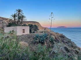 a house on a cliff overlooking the ocean