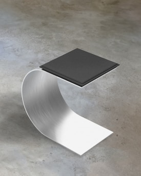 a metal object with a book on top of it