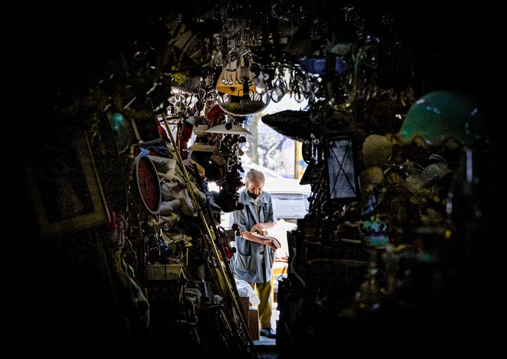 a man is walking through a narrow alley way