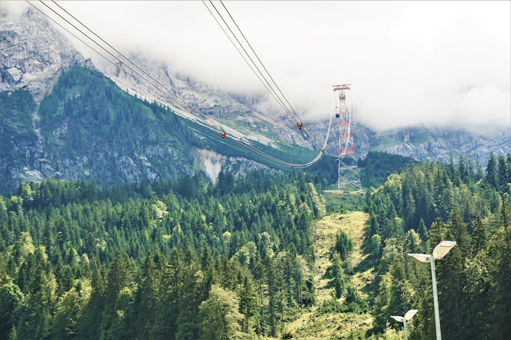 a cable car going up a mountain side