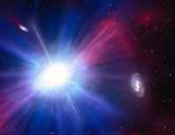 a bright blue and red star surrounded by stars
