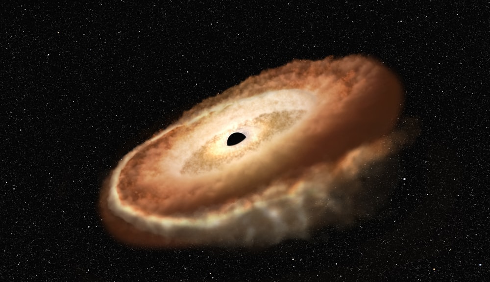 an artist's impression of a black hole in the sky