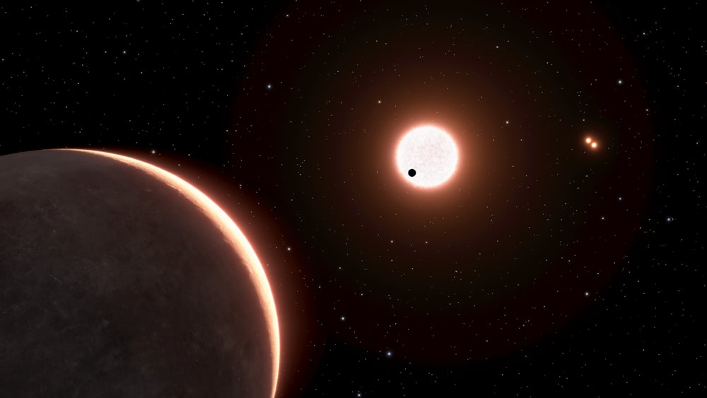 an artist's impression of a planet and a star