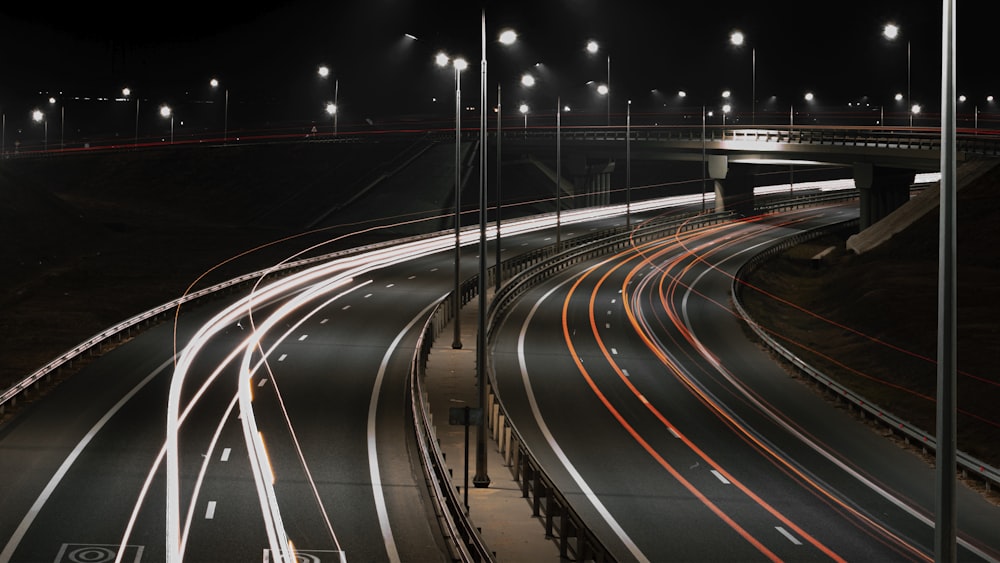 a night time picture of a highway with lights