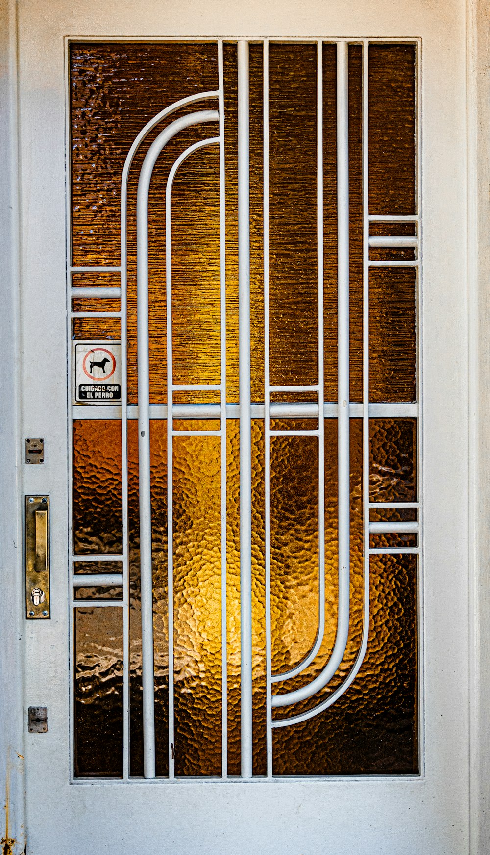 a white door with a glass design on it
