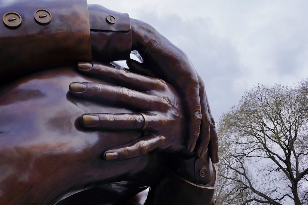 a close up of a statue of a person's hands