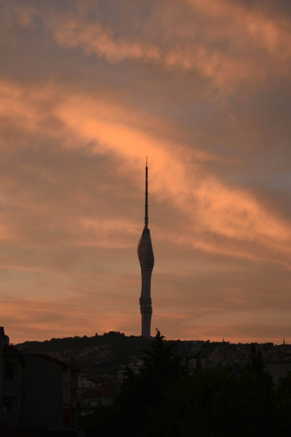 a very tall tower with a sky in the background