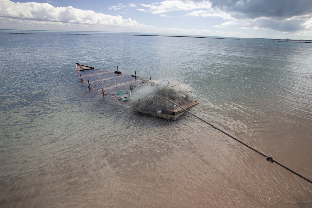 a boat sitting on top of a body of water