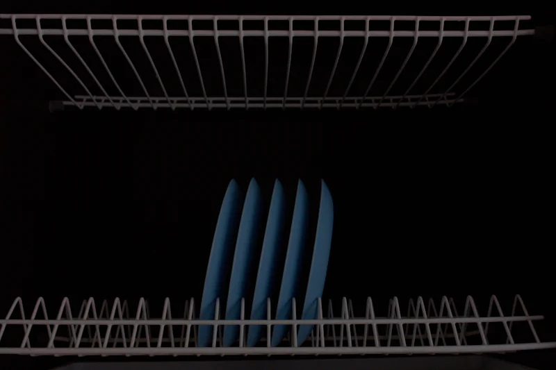 Close up of a dish rack in a kitchen
