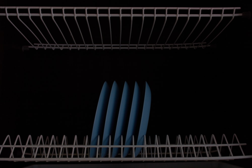 a close up of a dish rack in a kitchen