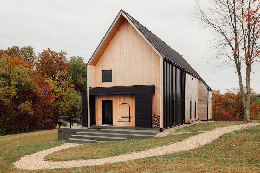 a black and white house with stairs leading up to it